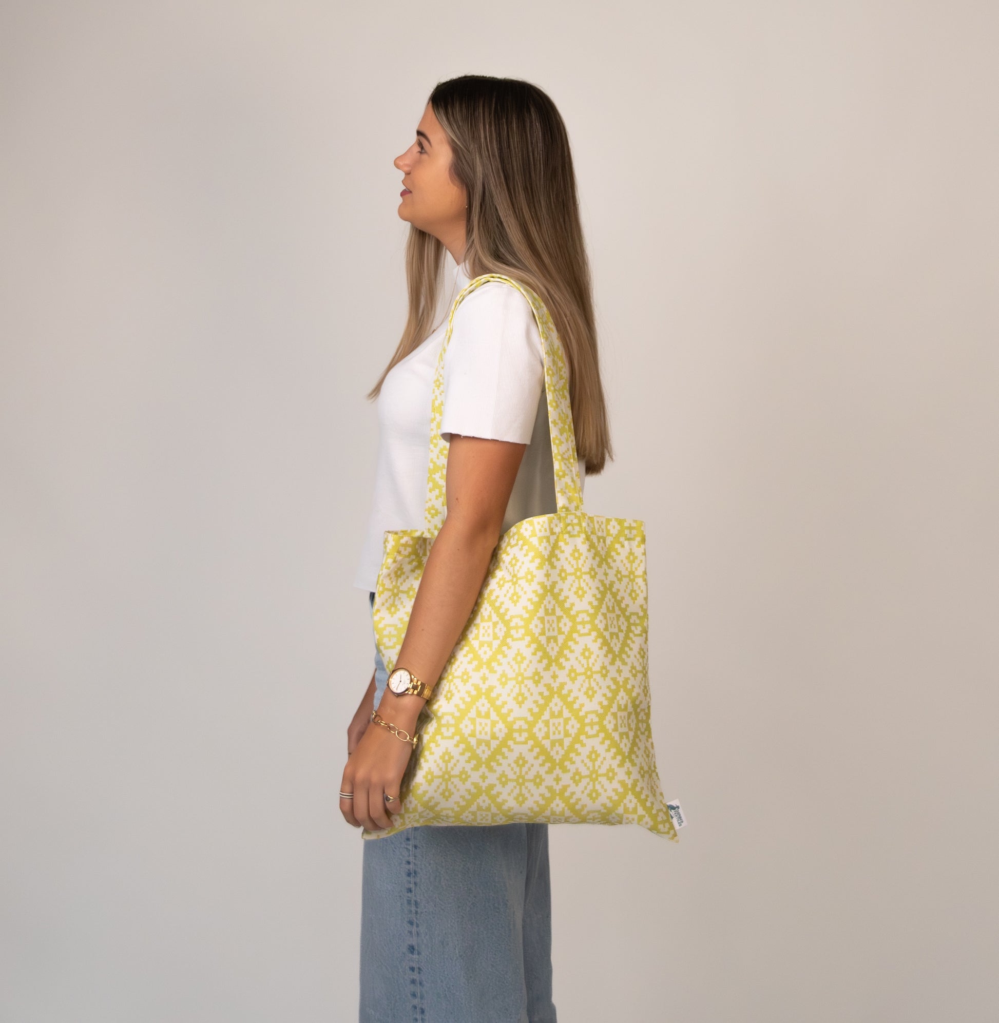 Model wearing Gazebo Chartreuse Tote over shoulder – Durable and UV-resistant yellow tote bag, perfect for beach, travel, or everyday use.