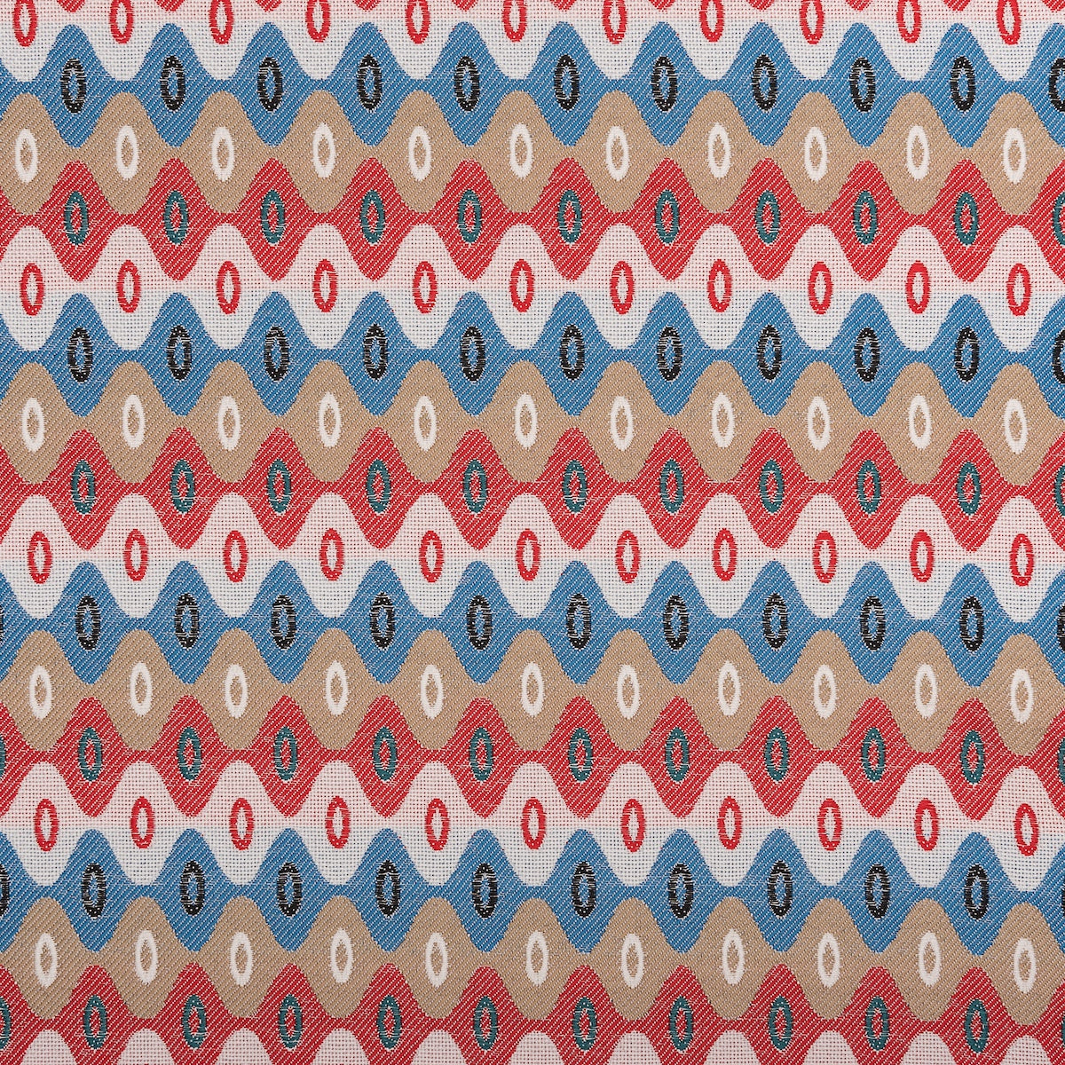 Colourful geometric upholstery fabric featuring repeating diamond and oval patterns in red, blue, beige, and green.